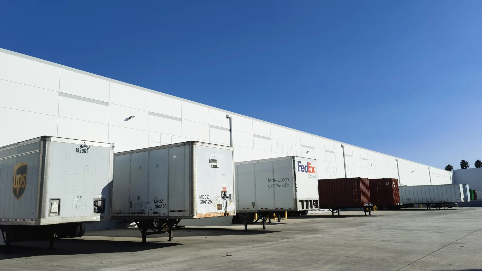 Trailers lined up at warehouse loading docks